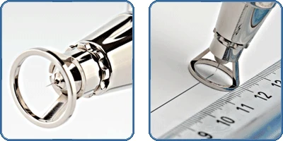 Two close views of the Infinity needle cap beside a millimetre rule