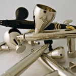 Group of gold and chrome airbrush bodies photographed together